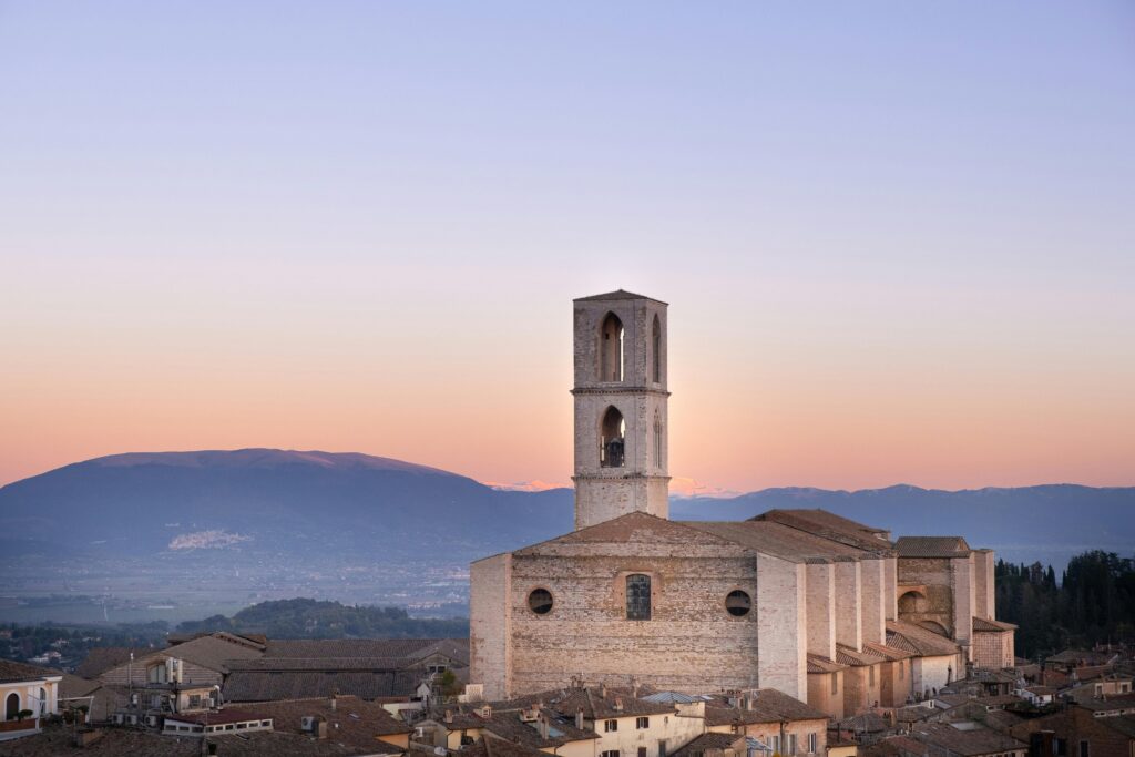A stunning aerial view of the San Domenico Basilica at dawn in Perugia, Italy.